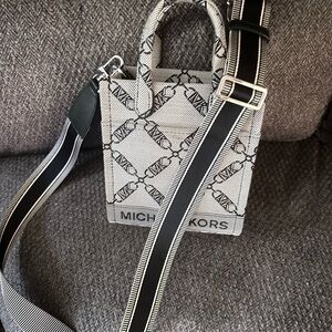 Michael Kors Black and White Women’s Bag. See photos for measurements.